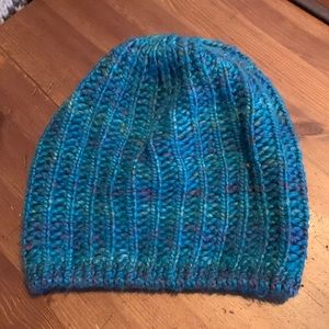 Multi coloured mostly teal knitted toque
